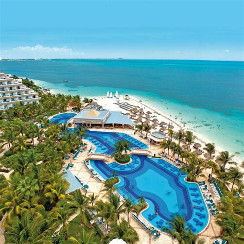 Hotel Riu Caribe is celebrated for its prime location near stunning beaches and local entertainment, with many guests complimenting the hotel's cleanliness and the variety of amenities, including pristine pools and diverse dining options. 
